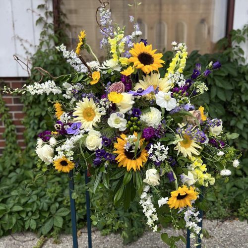 The value of this casket spray is $450. Flowers are subject to substitution based upon availability.